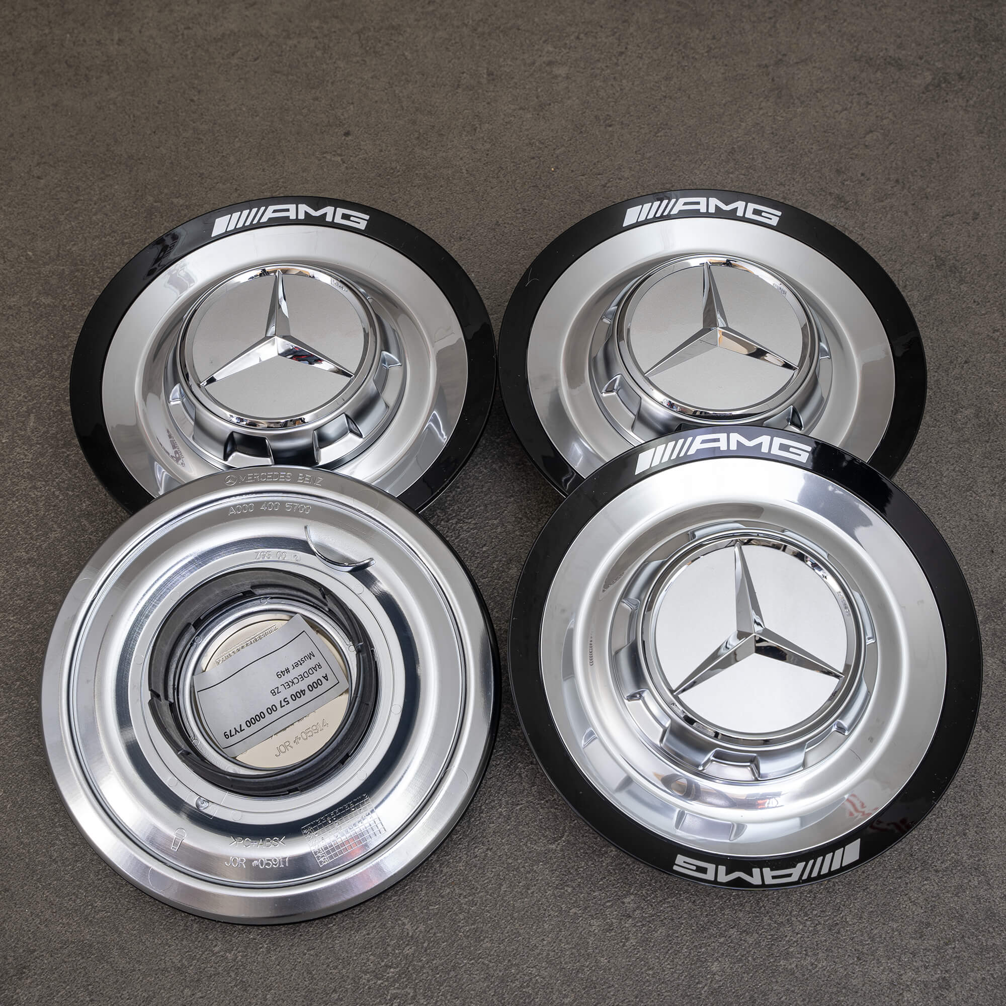 Oryginalna pokrywa piasty AMG do Mercedesa W177 W214 nr kat. A0004005700 czarna/srebrna NOWA